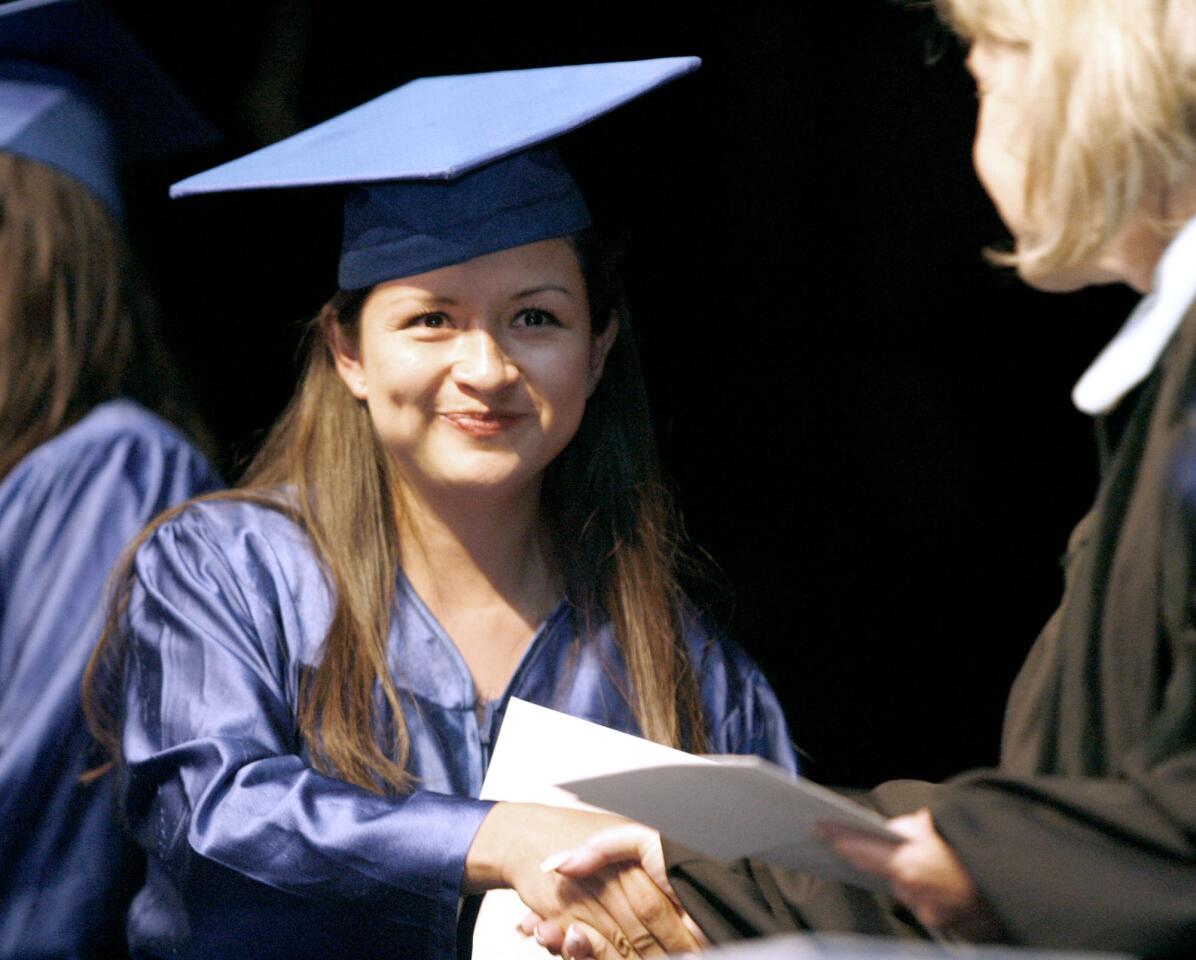 Rosa Batz receives her GED during the Burbank Adult School Graduation Ceremony at Luther Middle School Auditorium in Burbank on Wednesday, May 23, 2012.