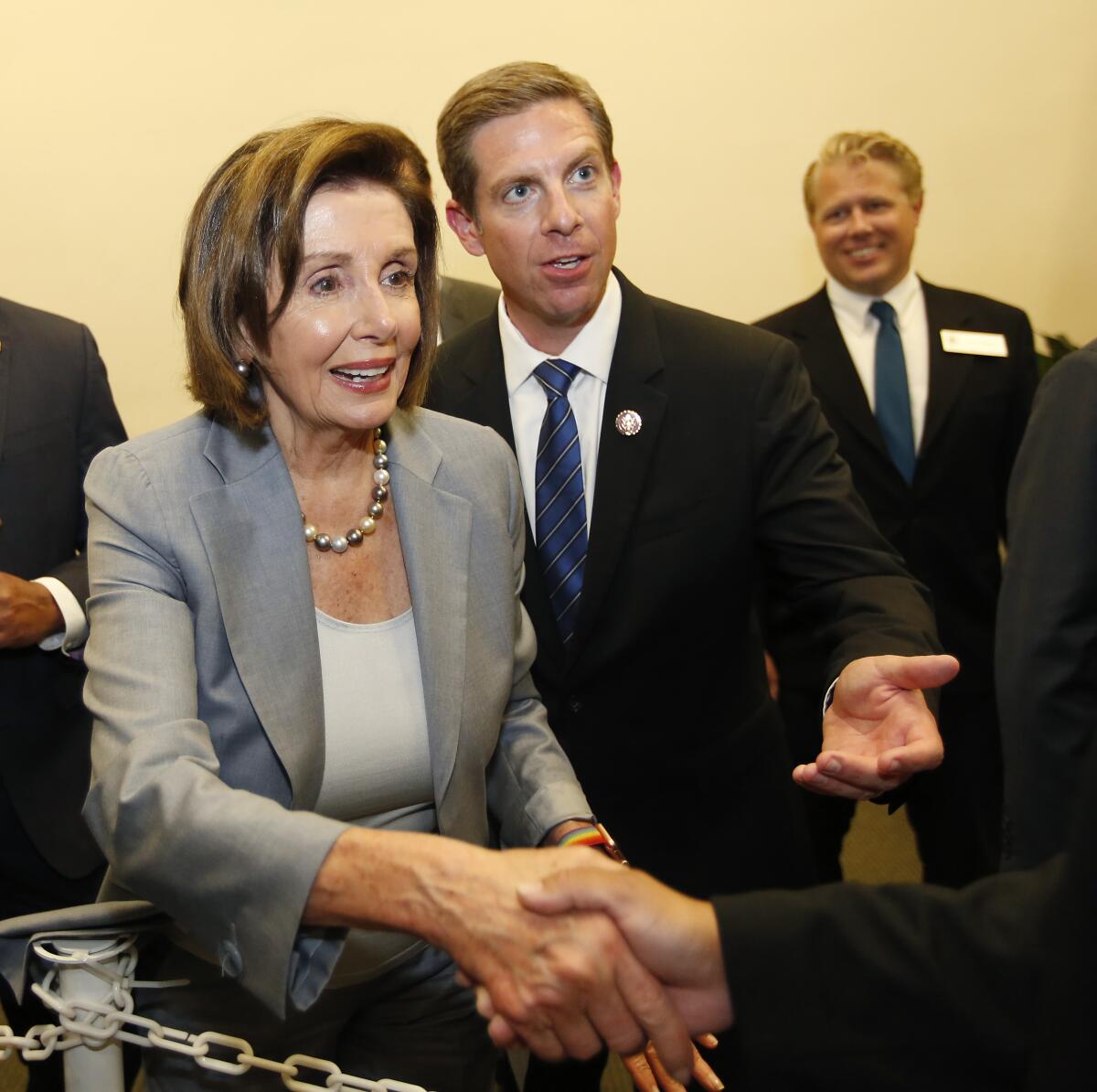 Speaker Nancy Pelosi with Rep. Mike Levin, right