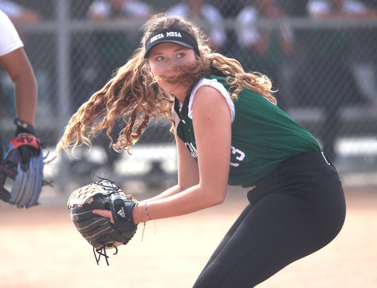 Costa Mesa's Harper Alexander (13) turns a bunt into an out at first base against Pasadena Mayfield on Thursday.