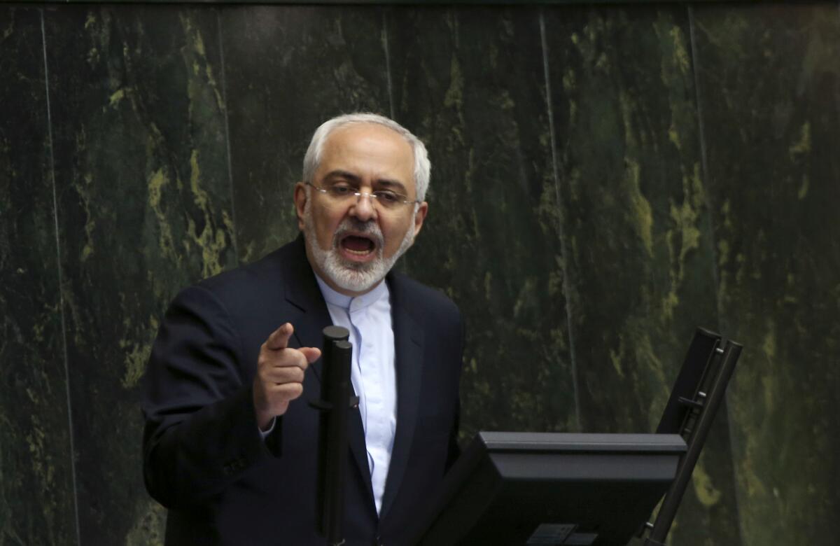 Iranian Foreign Minister Mohammad Javad Zarif, Iran's top nuclear negotiator, addresses an open session of the parliament in Tehran on July 21.