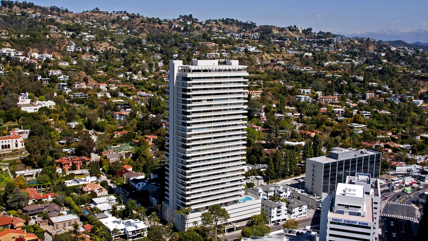 An aerial photo shows the Sierra Towers building rising above West Hollywood