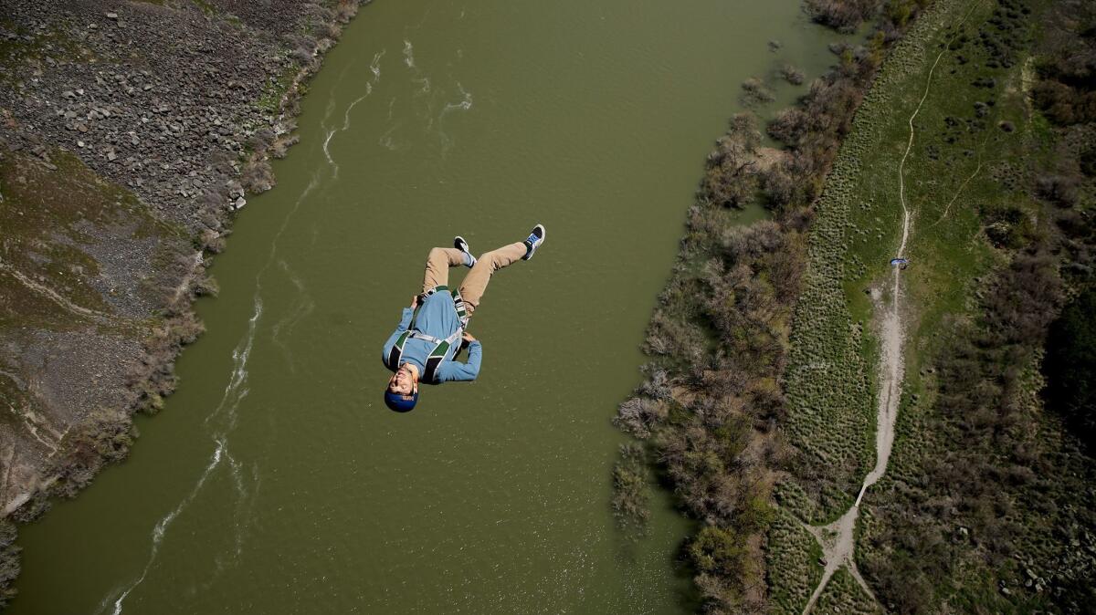 TWIN FALLS, IDAHO, SATURDAY, APRIL 29, 2017 -- A base jumper leaps from the Perrine Bridge above the Snake River. Numerous people flock to the bridge daily as it is widely known as the only bridge in the U.S. where one can jump without a permit. (Robert Gauthier/Los Angeles Times)