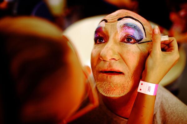 A performer has makeup applied at ACON House before the Sydney Gay & Lesbian Mardi Gras Parade.