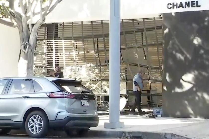 Burglary suspects use a stolen van to ram into a Chanel store in Beverly Grove on Tuesday, Oct. 25, 2022.