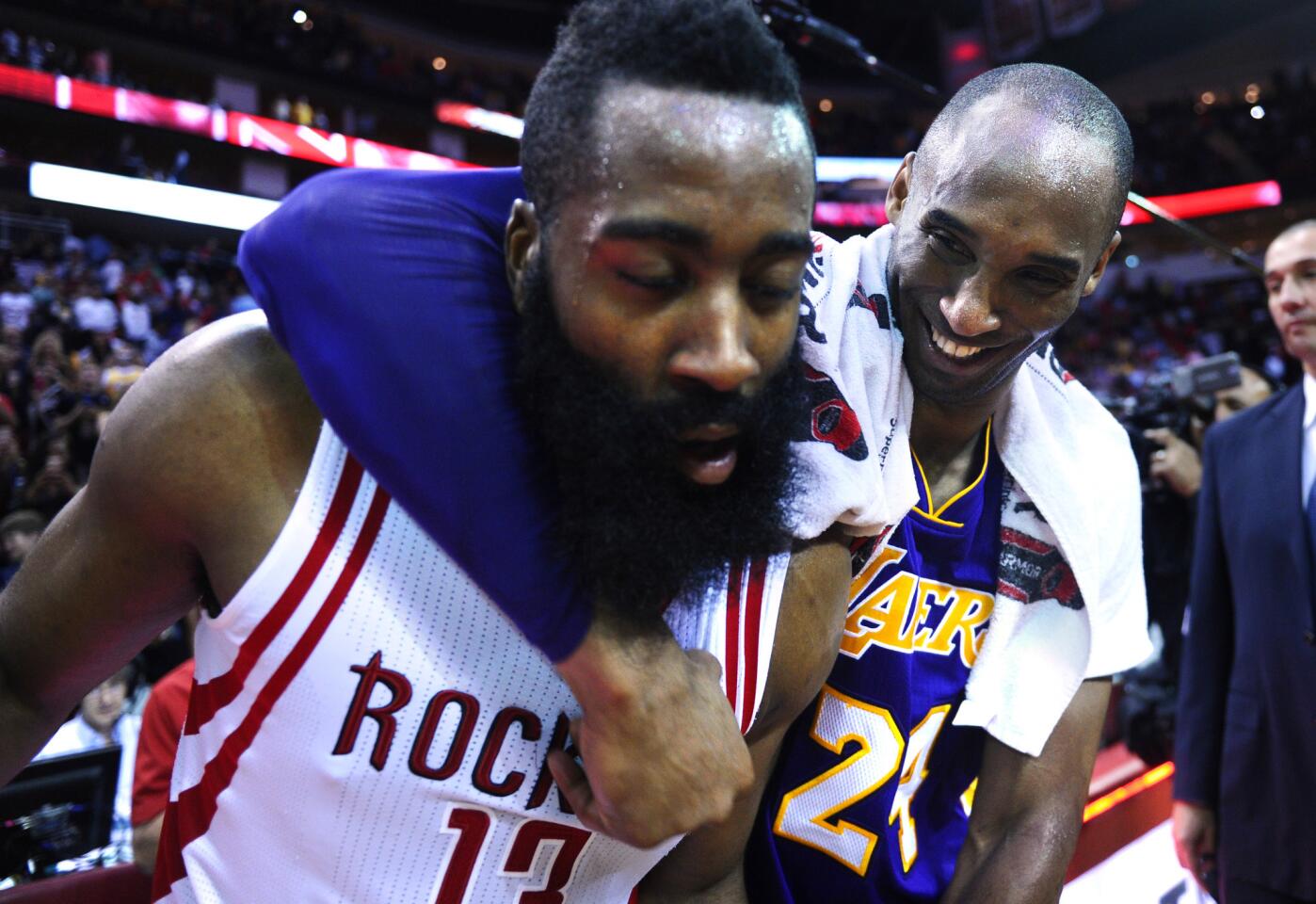 Kobe Bryant has a little fun with Rockets star James Harden after the game in Houston.