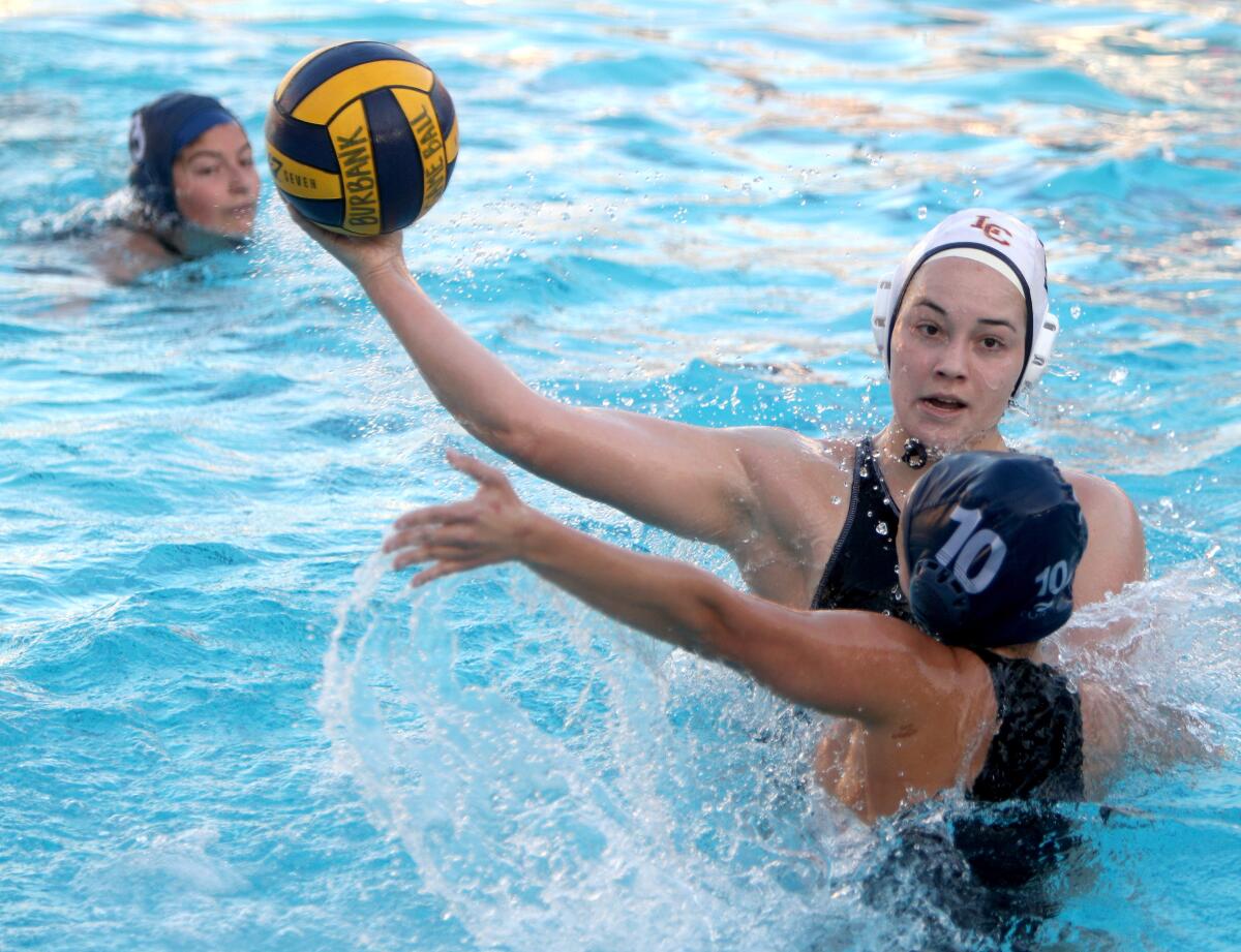 La Canada High School water polo player Tess Fundter scores in non-league game vs. Burbank High in Burbank on Thursday, Dec. 12, 2019.