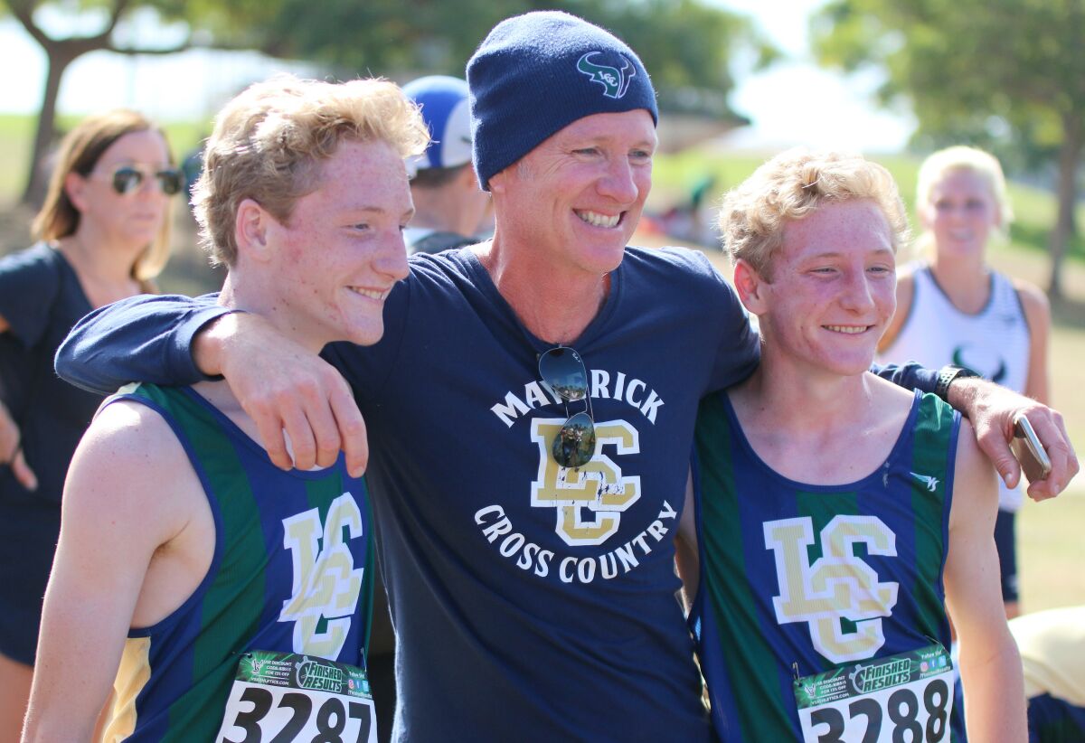 Jacob and Garrett Stanford, who went 1-2 at the 2018 CIF Championships share a post-race moment with their coach.