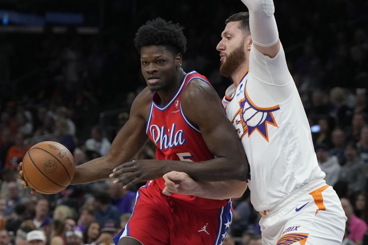 Philadelphia 76ers center Mo Bamba (5) drives on Phoenix Suns forward Drew Eubanks.