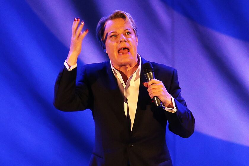 Comedian Eddie Izzard entertains a lively crowd at the Hollywood Bowl on Saturday evening.