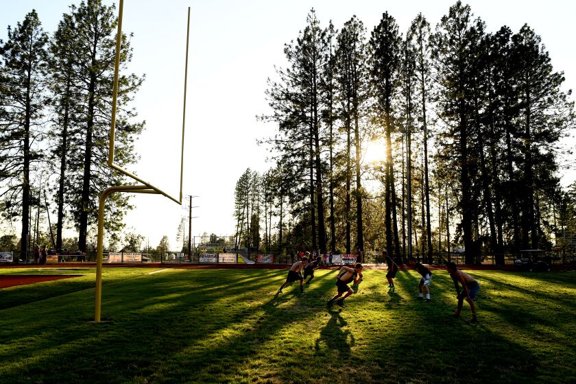 PARADISE, CALIFORNIA AUGUST 1, 2019-Paradise players practice in the late afternoon during football camp in preparation for the upcoming season. (Wally Skalij/Los Angeles Times)