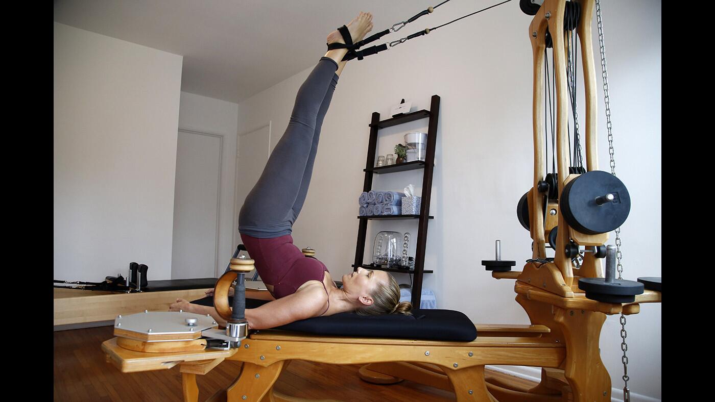 Danielle Thulin exercises on a Gyrotonic pulley tower, which was designed by a former dancer, at Integrative Elements in Mar Vista.