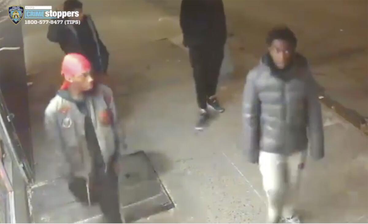 This still image taken from surveillance video provided by NYPD shows suspects in connection with the mugging of a 60-year-old man on Christmas Eve in the Morrisania neighborhood of the Bronx.