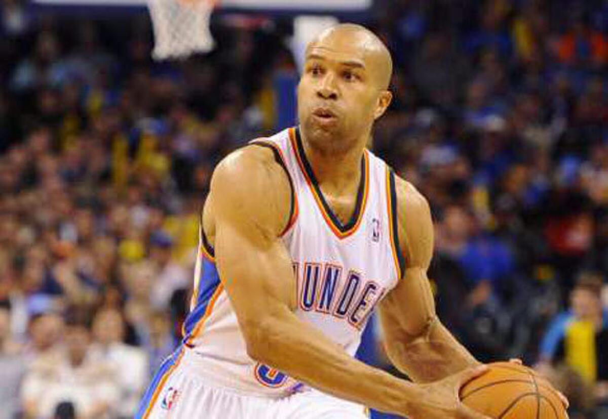 Oklahoma City Thunder point guard Derek Fisher, a former Laker, brings the ball down court against the Clippers.