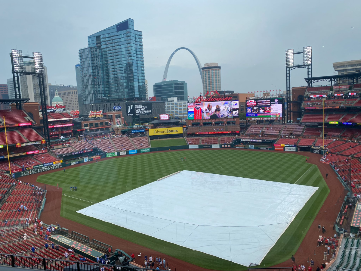 A tarp covers Busch Stadium in St. Louis before Friday's game between the Dodgers and St. Louis Cardinals.