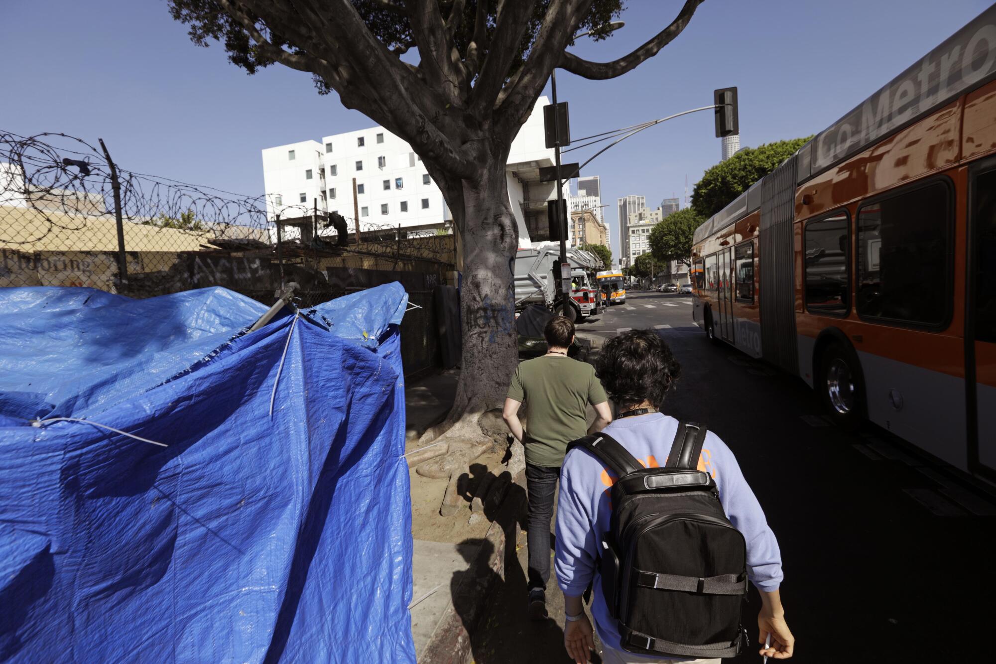 Dr. Rab, foreground, and Josh Finley, a resident in the UCLA-Olive View Psychiatry Residency Program, on the streets 