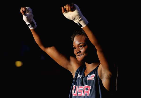 U.S. boxer Claressa Shields celebrates her victory over Marina Volnova of Kazakhstan during the women's middleweight semifinals. Shields will box for the gold against a Russian fighter.