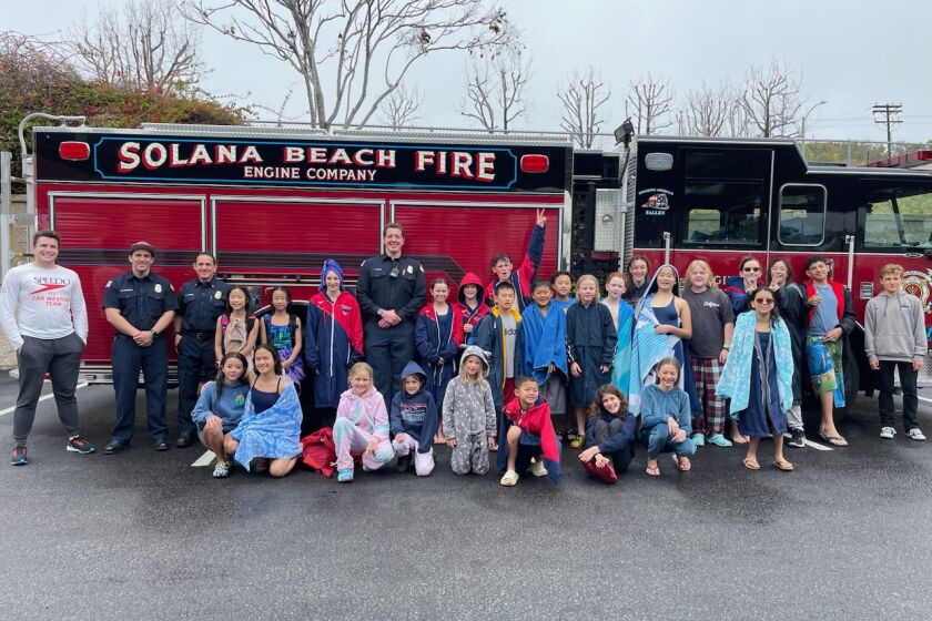 Solana Beach firefighters joined Swim-a-Thon and helped flip pancakes.