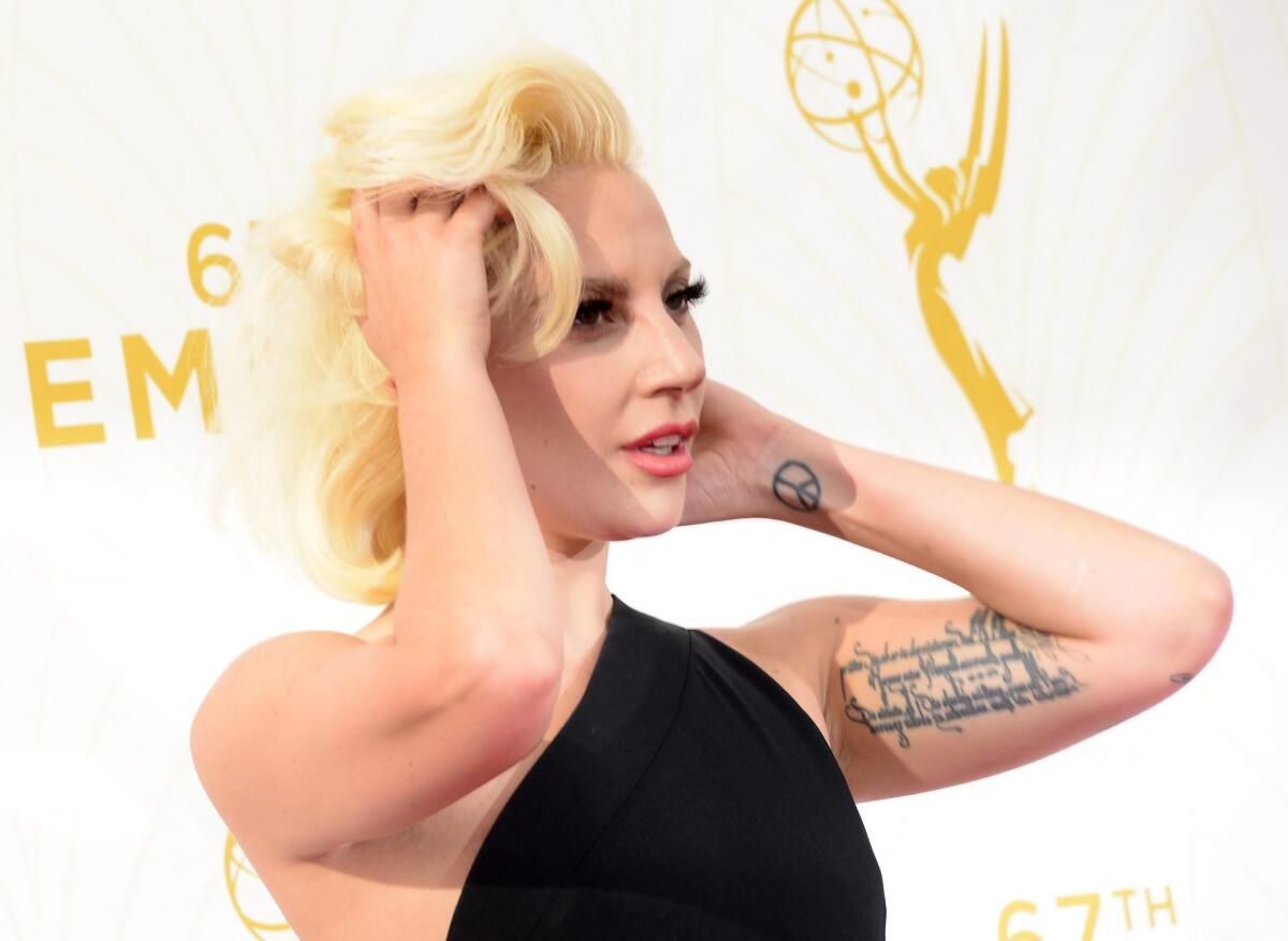 Lady Gaga, shown in Los Angeles at the Primetime Emmy Awards, has been named Billboard's woman of the year and will be feted on Dec. 11 at the magazine's annual "Women in Music" awards in New York.