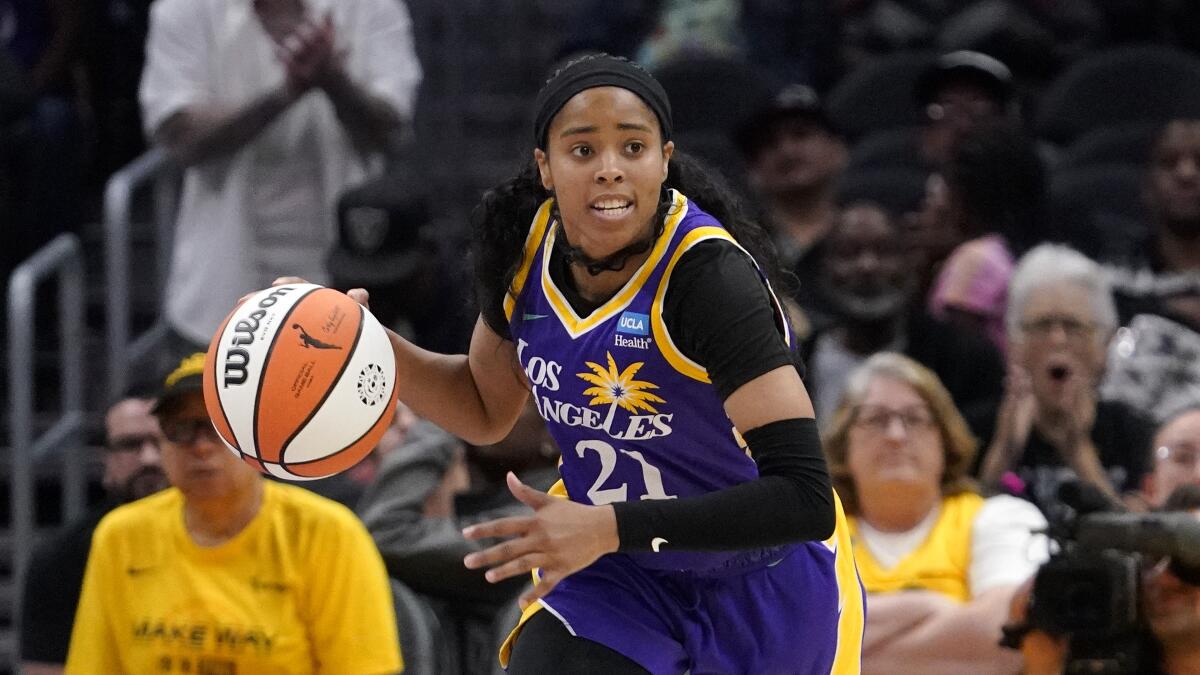 Los Angeles Sparks guard Jordin Canada dribbles during the second half of a WNBA basketball game.