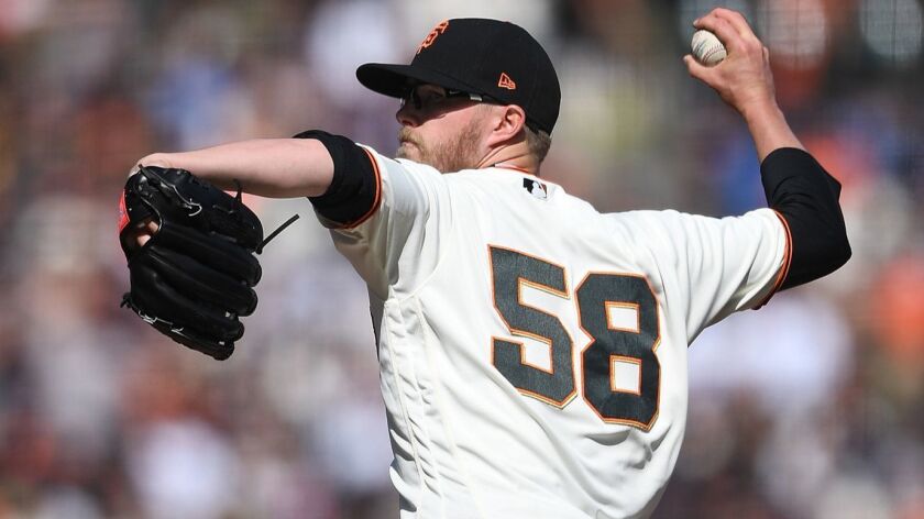 Giants reliever Pierce Johnson pitches against the Los Angeles Dodgers in the top of the 10th inning at AT&T Park on April 8, 2018 in San Francisco, California.