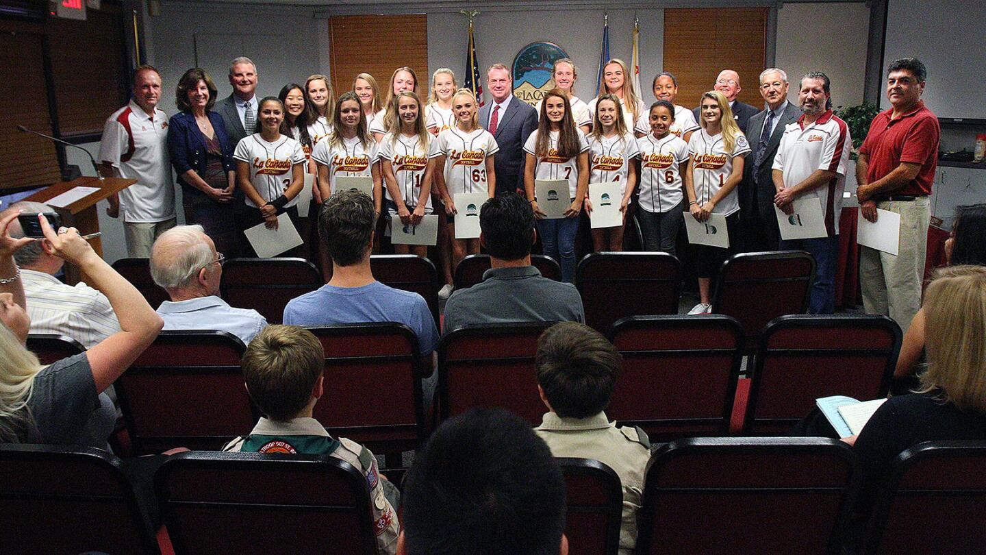 A proud moment for the La Cañada 14U softball team as they stand with the at La Cañada Flintridge City Council being recognized as champions in La Cañada on Tuesday, September 20, 2016. The team won 7 straight playoff games to win the Western National Championship, and was recognized by the La Cañada Flintridge City Council for their accomplishment.
