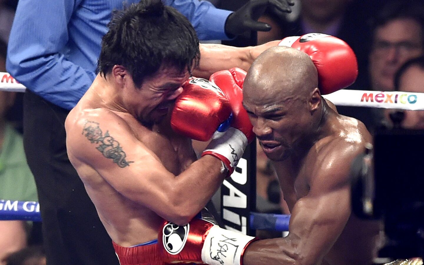 FLoyd Mayweather Jr. lands a punch to Manny Pacquaio in the fourth round Saturday in Las Vegas.