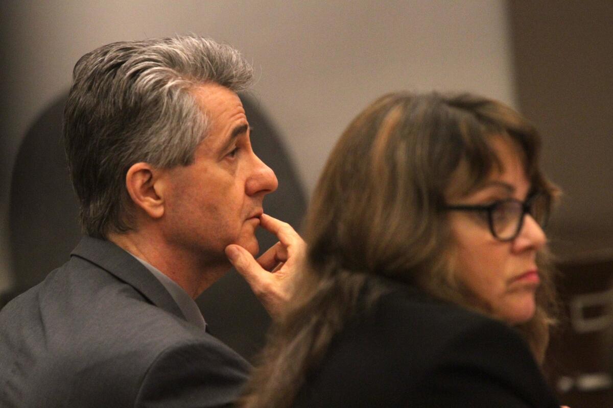 Paul Marshal Curry listens in court Tuesday during his murder trial. Deputy Public Defender Lisa Kopelman sits by his side.