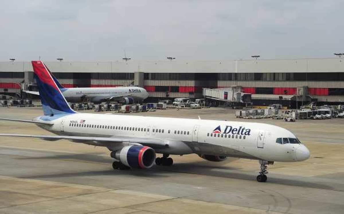 A Delta Airlines jets arrives at Atlanta-Hartsfield International Airport. Passengers on two Atlanta-bound Delta flights over the weekend discovered sewing needles in sandwiches served by the airline.