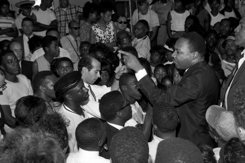 Martin Luther King Jr. speaks at a Westminster Neighborhood Assn. gathering on Aug. 18, 1965, during what became known as the Watts riots.