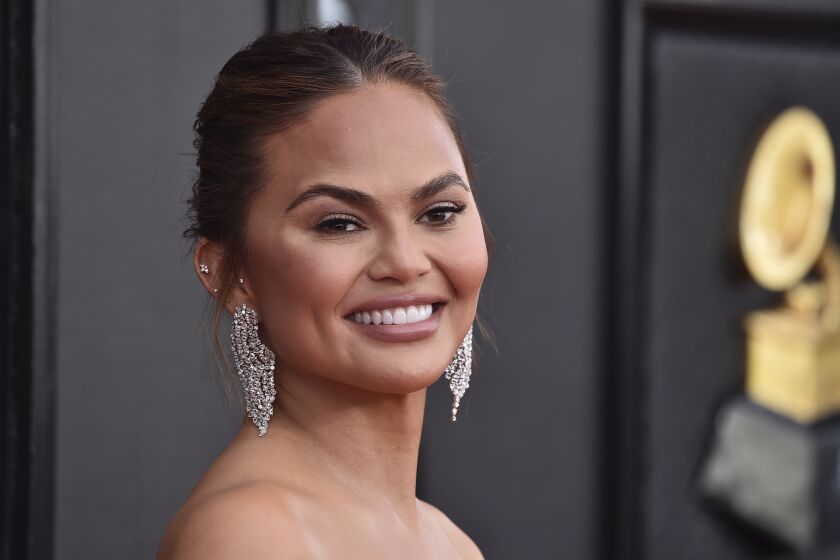 Chrissy Teigen arrives at the 64th Annual Grammy Awards at the MGM Grand Garden Arena on Sunday, April 3, 2022, in Las Vegas. (Photo by Jordan Strauss/Invision/AP)