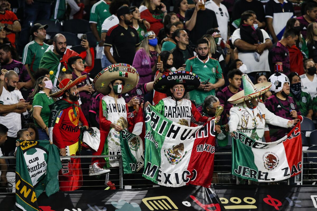 Mexico fans cheer on the 