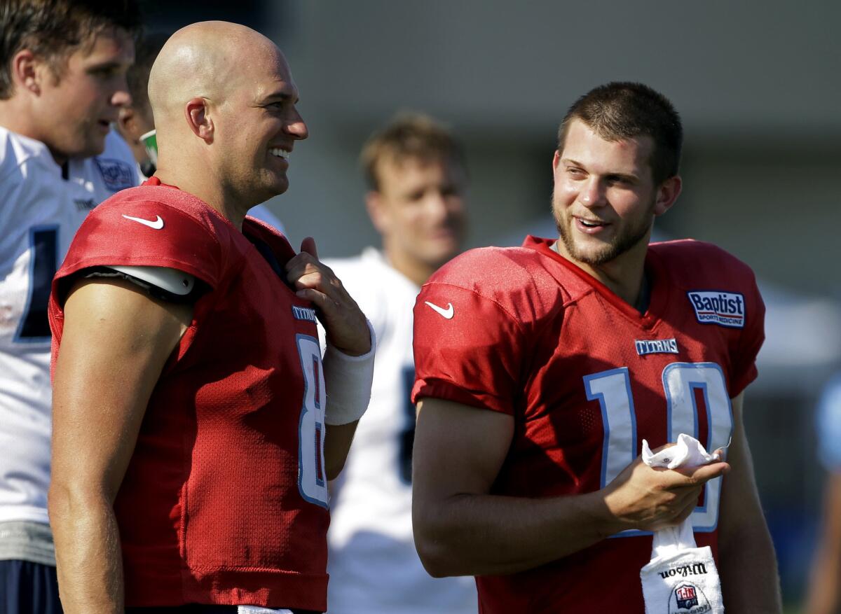 Former Titans quarterback Jake Locker, right, announced Tuesday his decision to retire from the NFL after four years with Tennessee.