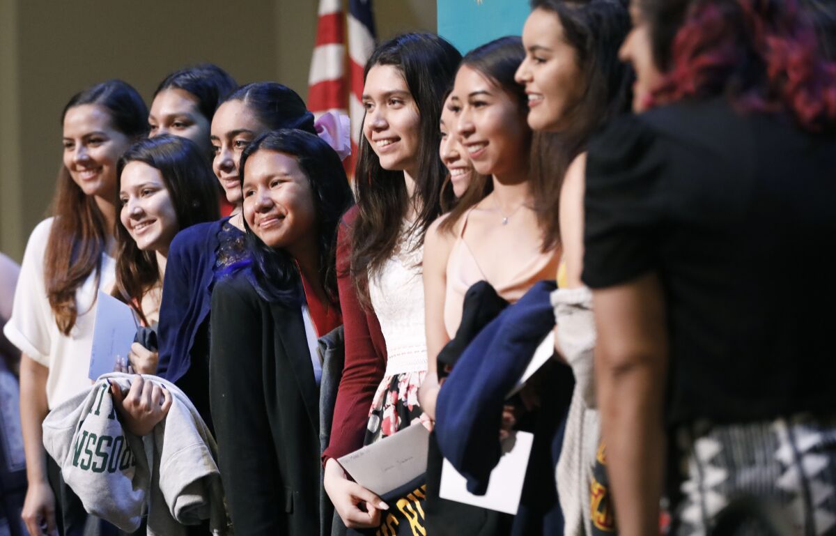 High school students in Mana de San Diego's Hermanitas youth leadership mentoring program graduated from the program June 1. Now organizers of the group, which serves Latina youth, ages 11-18, are giving participants laptops.