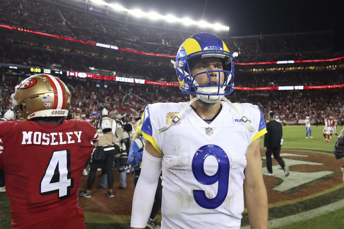 Rams quarterback Matthew Stafford walks off the field after losing to the 49ers.