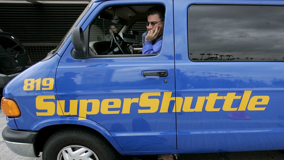 In a party-line vote, Republican members of the National Labor Relations Board sided against SuperShuttle van drivers who were seeking to unionize. Above, a SuperShuttle driver in 2005.