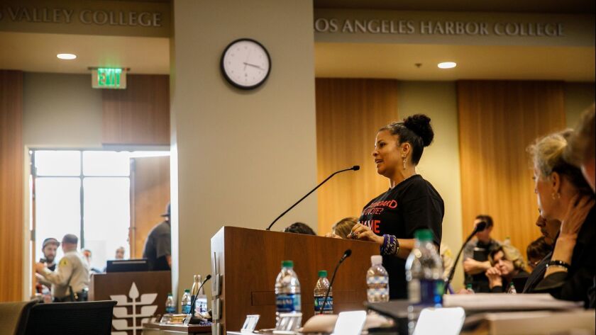 Melina Abdullah and other protesters speak during a Los Angeles Community College trustees meeting to voice their dissatisfaction over their choice of electing a Latino man over three African American women to fill a vacant board seat.