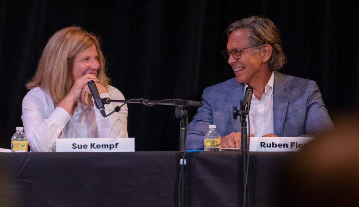 Laguna Beach City Council candidates Mayor Sue Kempf and Ruben Flores share a laugh during Saturday's forum.