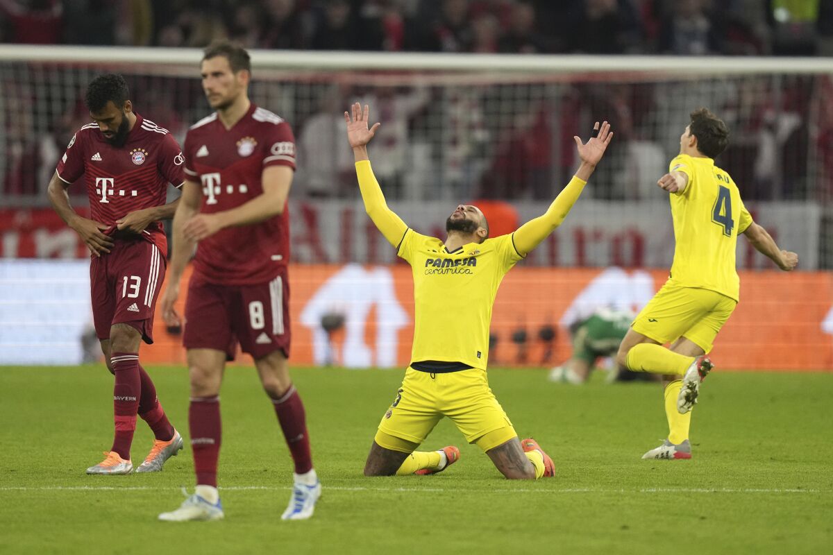 Villareal players celebrate end of the Champions League, second leg, quarterfinal soccer match between Bayern Munich and Villareal at the Allianz Arena, in Munich, Germany, Tuesday, April 12, 2022. (AP Photo/Matthias Schrader)
