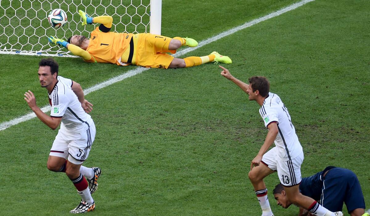 Germany defender Mats Hummels, left, and teammate Thomas Muller celebrate after Hummels scored past France goalkeeper Hugo Lloris in the first half of their World Cup semifinal on Friday at Estadio do Maracana in Rio de Janeiro.