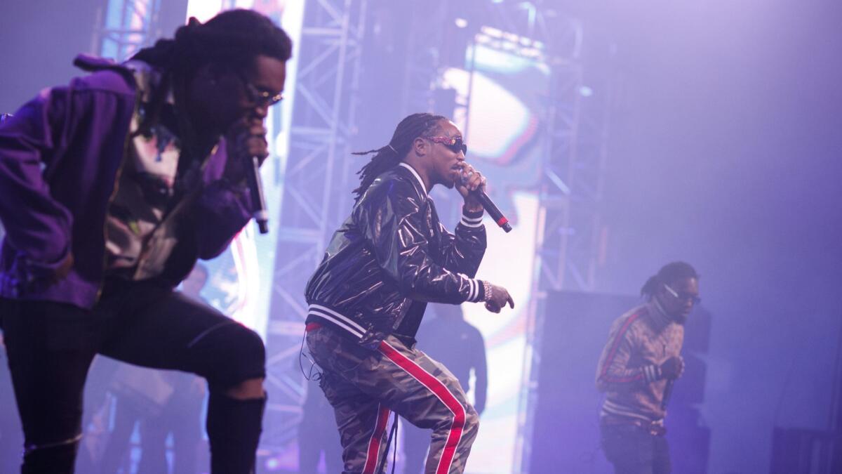 Takeoff, from left, Quavo and Offset, of Migos, performing at the Rolling Loud festival in San Bernardino, Calif. on Dec. 16, 2017.
