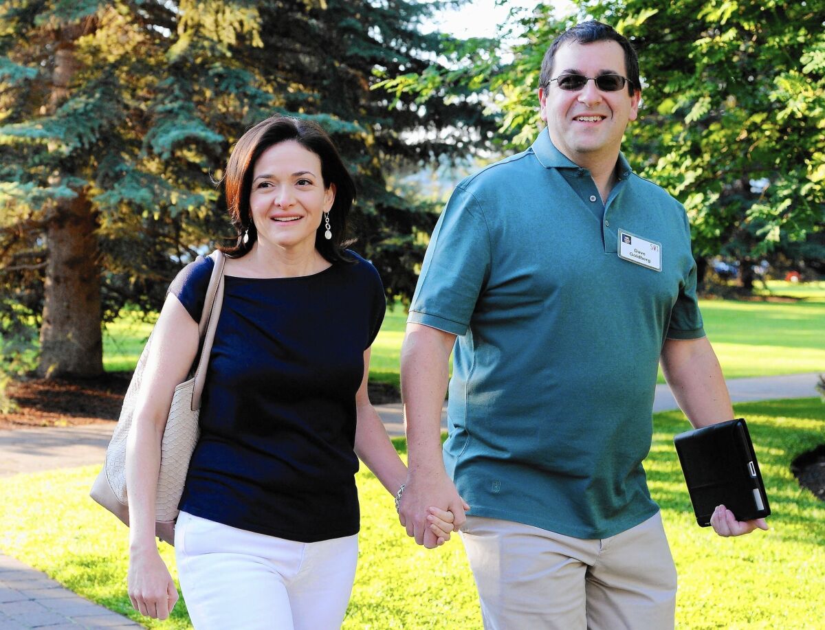 Sheryl Sandberg and husband David Goldberg attend the annual Allen & Co. conference in Sun Valley, Idaho, in July 2013. Goldberg, 47, died a month ago died after apparently falling off a treadmill while on vacation in Mexico.