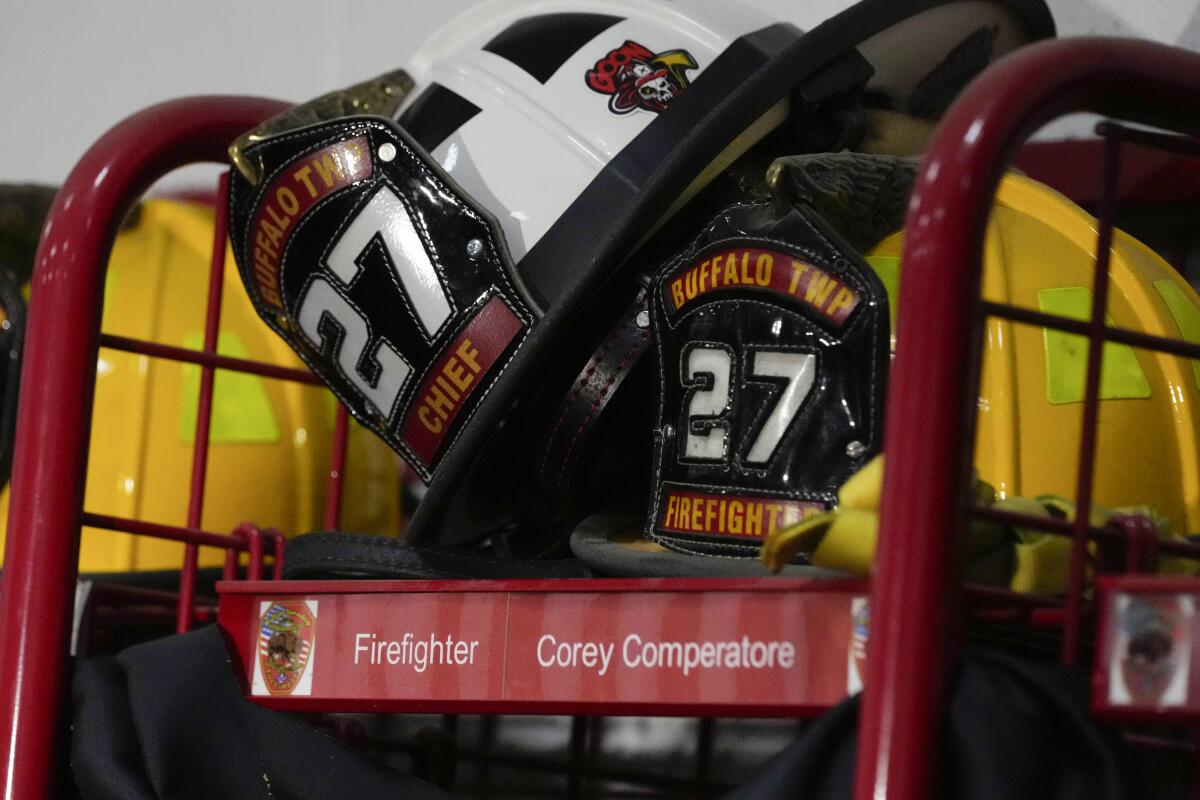 Helmets rest on the locker of firefighter Corey Comperatore at the Buffalo Township Fire Company.