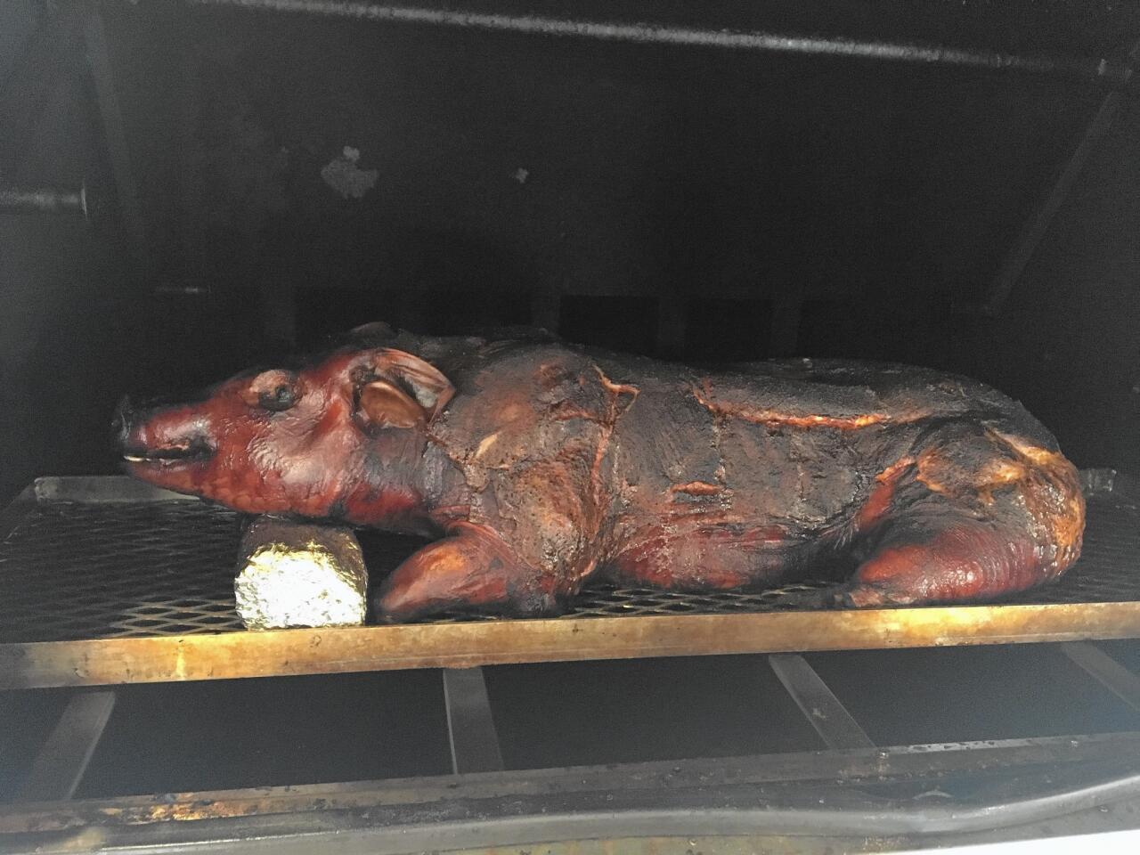 Should you wish to behold the glory that is an entire pig being smoked at Pappy's Smokehouse, Mike "Pappy" Emerson will show you how it's done.