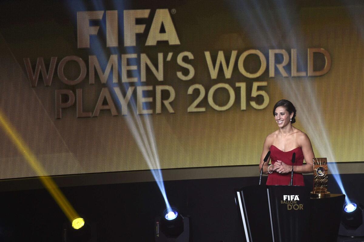 United States midfielder Carli Lloyd poses after receiving the 2015 FIFA Women's World Player of the Year award during the 2015 FIFA Ballon d'Or award ceremony.
