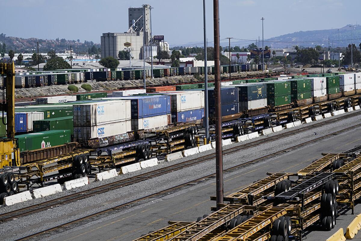 Freight train cars at a rail yard.