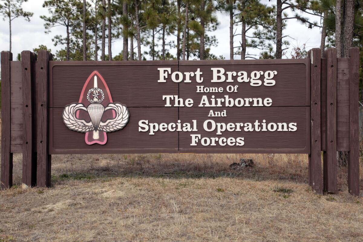 FILE - A sign is seen at Fort Bragg on Feb. 3, 2022, in Fort Bragg, N.C. Killian Mackeithan Ryan, a soldier in the U.S. Army, wrote on Instagram that he joined the military “for combat experience so I’m more proficient in killing” Black people, according to investigators. Ryan's alleged social media activity is documented in a case filed in late August 2022 in U.S. District Court in North Carolina that accuses him of providing false information on a security clearance form to serve at Fort Bragg. (AP Photo/Chris Seward, File)