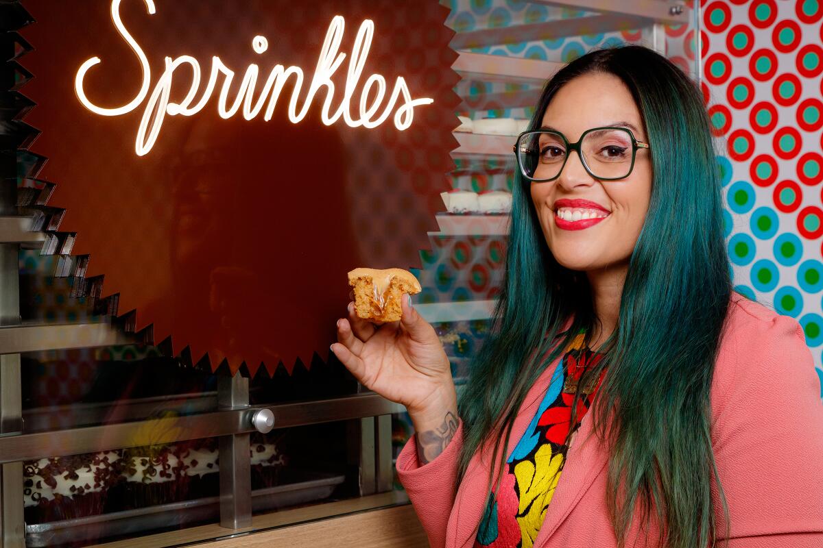 Chef Claudette Zepeda with a La Gloria cupcake.