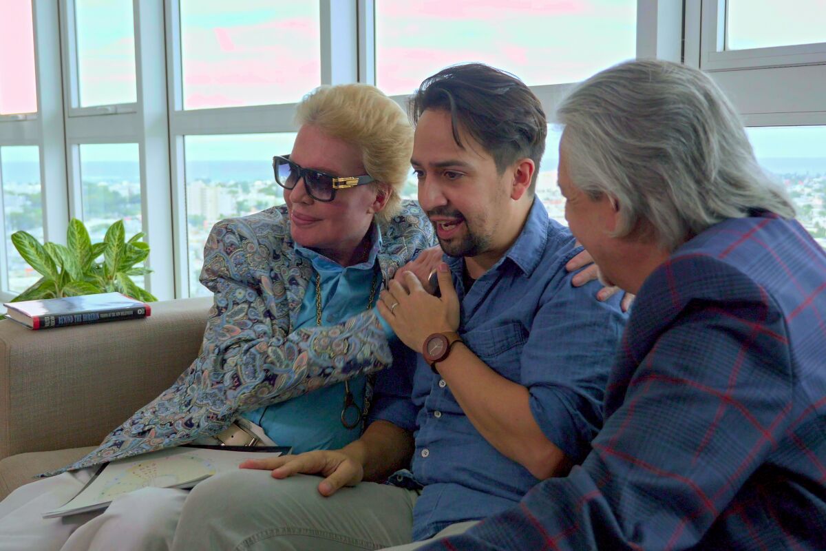 Walter Mercado meets with Lin-Manuel Miranda and Luis Miranda in "Mucho Mucho Amor."