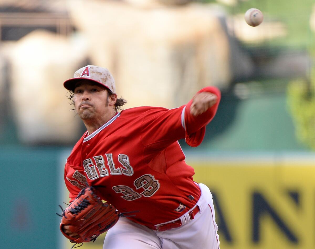 Angels pitcher C.J. Wilson threw his first complete game in more than two years, beating Tampa Bay, 6-0, on Saturday.