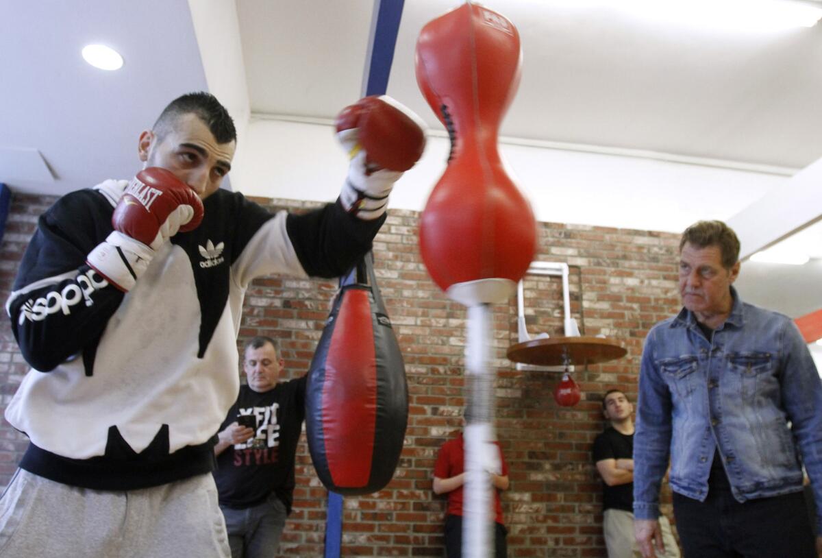 With trainer Joe Goosen keeping a close watch at right, boxer Vanes Martirosyan trains at Ten Goose Boxing gym in Van Nuys on Tuesday, March 11, 2014 as he prepares for an upcoming fight.
